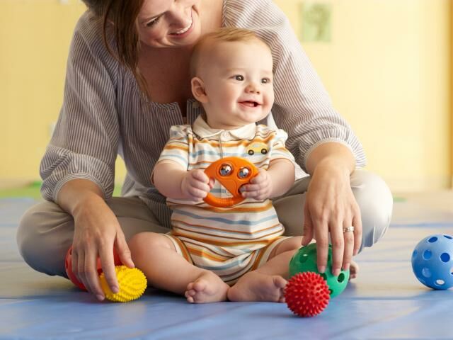 infant-playing-with-mom1.jpg